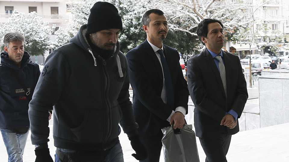Fugitive Turkish soldiers Suleyman Ozkaynakci and Bilal Kurugul arrive at Supreme Court of Greece Areios Pagos in Athens, Greece on January 10, 2017. Greek court begins to hear appeal cases for fugitive Turkish soldiers wanted by Ankara in connection with July 15 coup attempt in Turkey.
