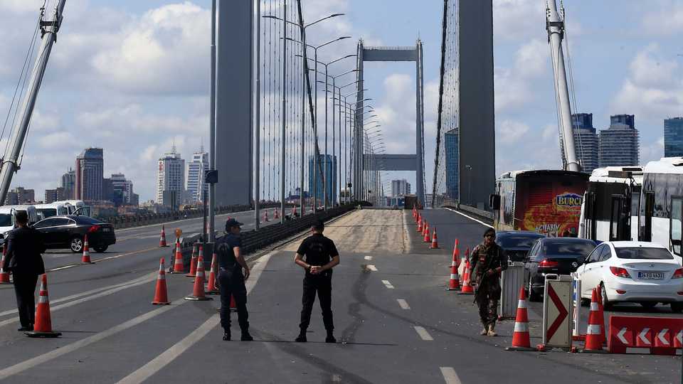 Turkish police officers secure the July 15 Martyr's bridge ahead of a ceremony to commemorate the anniversary of the July 15, 2016 coup attempt, in Istanbul, July 15, 2017.