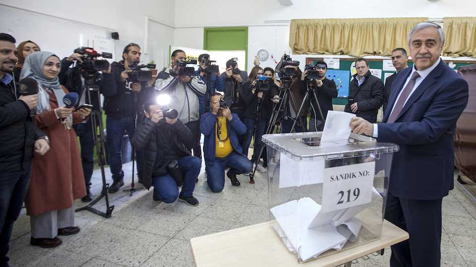 Turkish-Cypriot President Mustafa Akinci casts his ballot for the parliamentary election at a polling station in the northern part of Nicosia in the Turkish Republic of Northern Cyprus (TRNC), on January 7, 2018.
