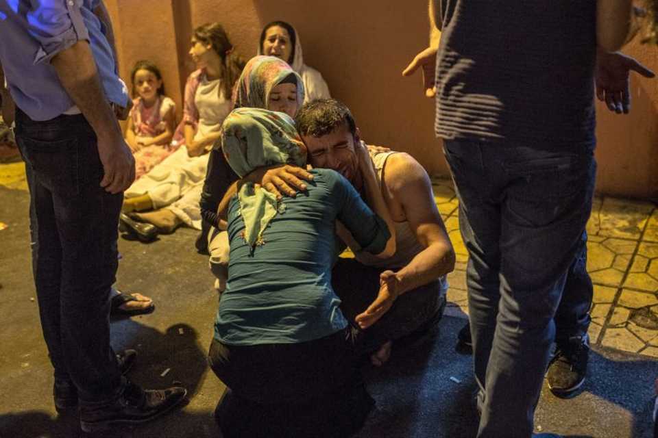 Relatives grieve at a hospital August 20, 2016 in Gaziantep following a late night militant attack on a wedding party in southeastern Turkey. 