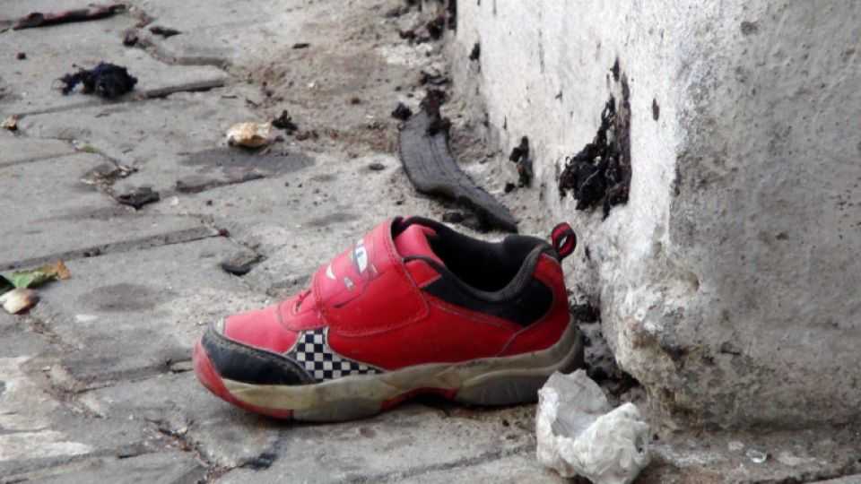 A shoe belonging to one of the 22 children killed in a suicide bombing on Saturday