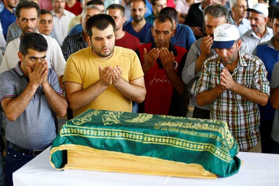 Family members of Sehriban Nurbay, a 3-month-old victim of a suicide bombing at a wedding in Gaziantep, attend her funeral ceremony in the southern Turkish city of Gaziantep
