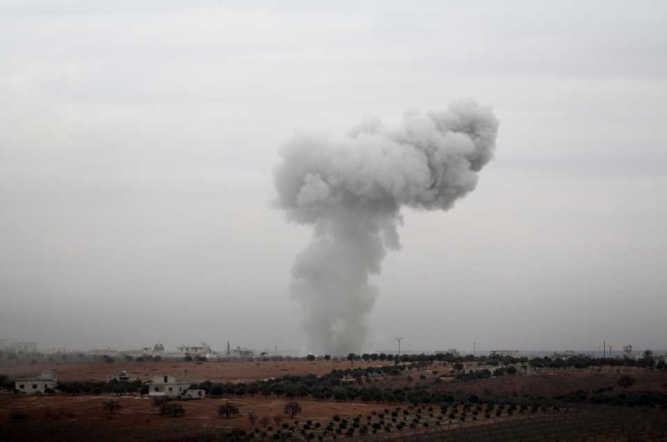 A cloud of smoke is seen near Al Tamanah, in Syria's northwestern opposition-held province of Idlib on January 2, 2018.