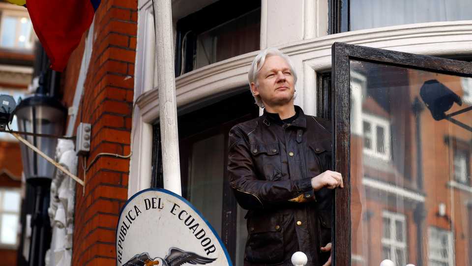 This May 19, 2017 file photo shows Julian Assange greeting supporters outside the Ecuadorian embassy in London.