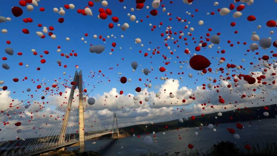 Red and white balloons are released during the opening ceremony of newly built Yavuz Sultan Selim bridge, the third bridge over the Bosphorus linking the city's European and Asian sides in Istanbul, Turkey, August 26, 2016.