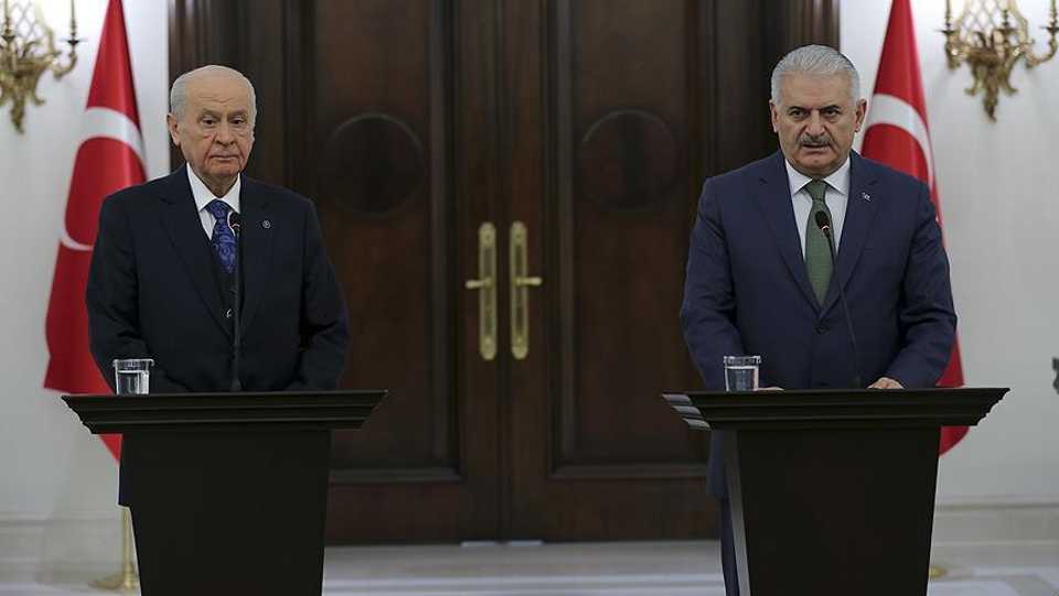 Devlet Bahceli (left), Chairman of the opposition Nationalist Movement Party (MHP) during a joint press conference with the Prime Minister Binali Yildirim (right) on January 20, 2018.