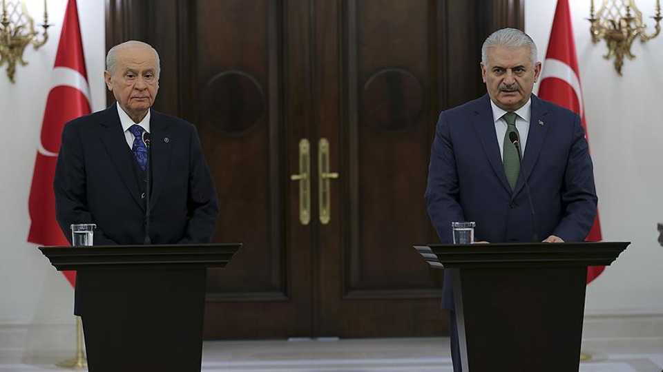 Devlet Bahceli (left), Chairman of the opposition Nationalist Movement Party (MHP), during a joint press conference with Prime Minister Binali Yildirim (right) on January 20, 2018.