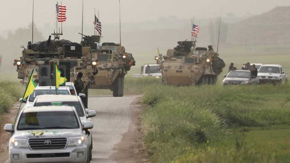 American special forces escort a YPG unit in the town of Darbasiya next to the Turkish border, Syria in the late April 2017. YPG, PKK's Syrian wing, is the backbone of US-backed Syrian Democratic Forces.