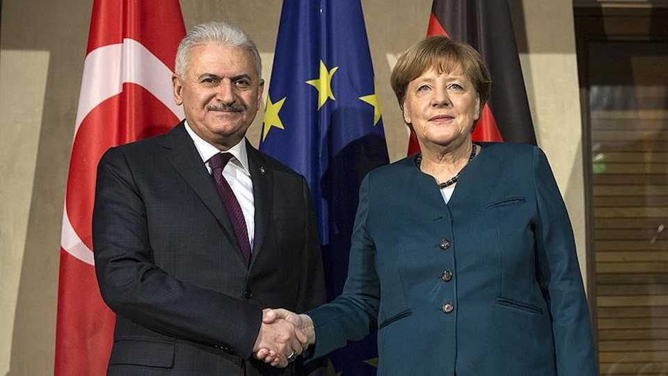 Following the meeting with German Chancellor Angela Merkel (R) Turkish Prime Minister Binali Yildirim (L) to attend to Munich Security Conference.