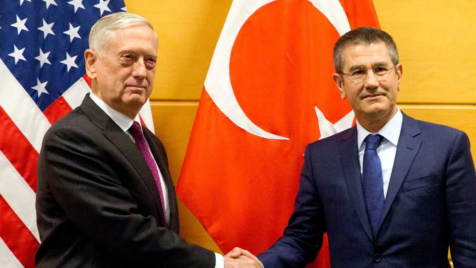 US Secretary of Defense James Mattis poses with Turkish Defence Minister Nurettin Canikli during a NATO defence ministers meeting at the Alliance headquarters in Brussels, Belgium, February 14, 2018.