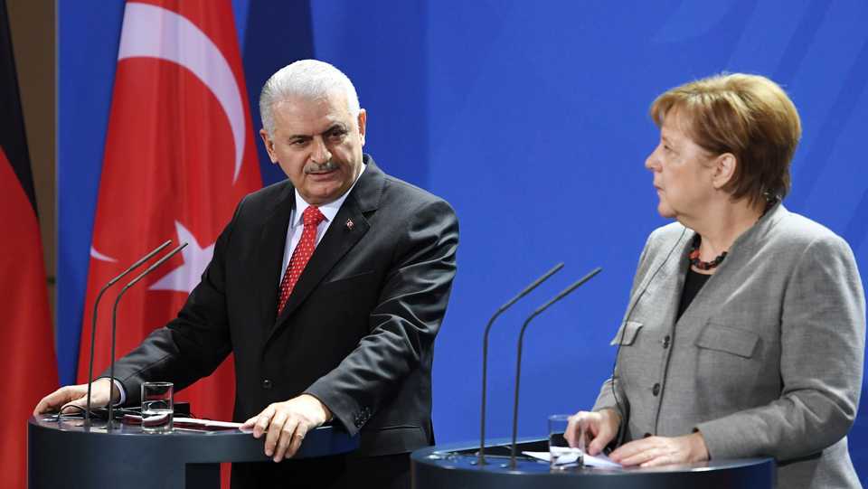 German Chancellor Angela Merkel and Turkish Prime Minister Binali Yildirim attend a news conference at the Chancellery in Berlin, Germany February 15, 2018.