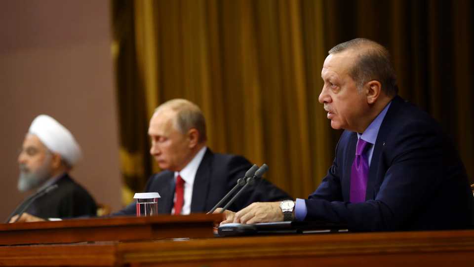 Turkish President Recep Tayyip Erdogan (R), Russian President Vladimir Putin (C) and Iranian President Hassan Rouhani (L) hold a joint press conference following the trilateral summit to discuss progress on Syria, between the Presidents of Turkey, Russia and Iran on November 22, 2017 in Sochi, Russia.