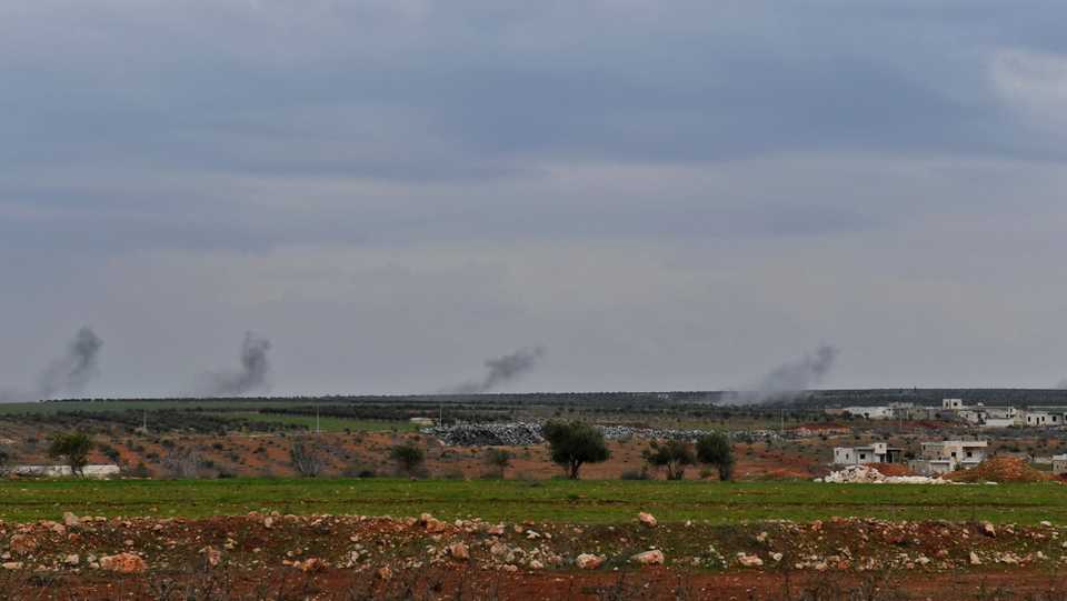 A picture taken on February 20, 2018 shows smoke from Turkish artillery fire near the northern Syrian region of Afrin. Turkey halted pro-Syrian regime forces as they tried to enter Afrin region.