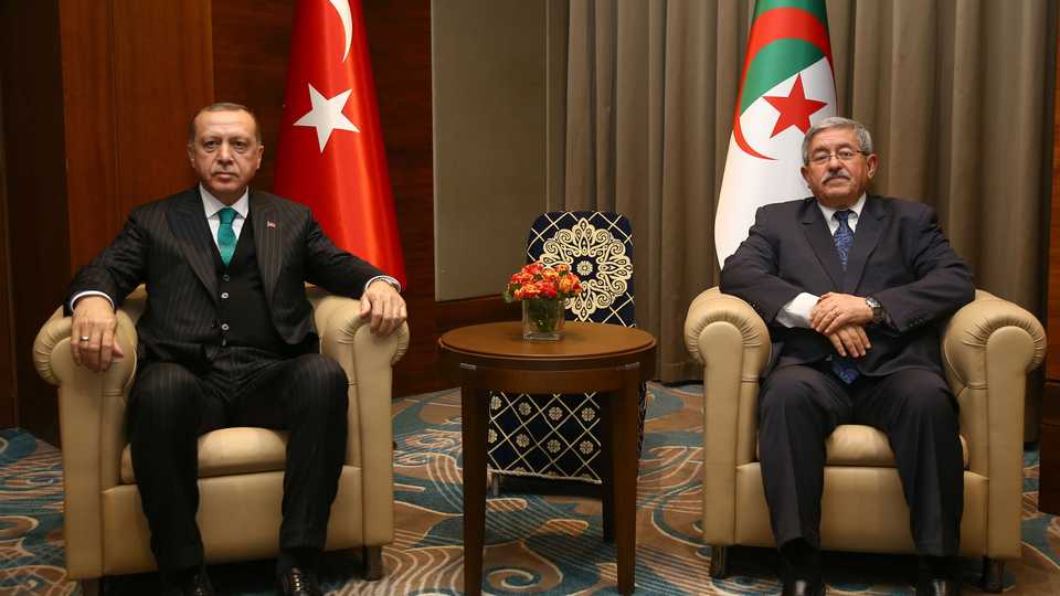 President of Turkey Recep Tayyip Erdogan (L) meets Prime Minister of Algeria Ahmed Ouyahia after an official welcoming ceremony at Houari Boumediene Airport in Algiers, Algeria on February 26, 2018.