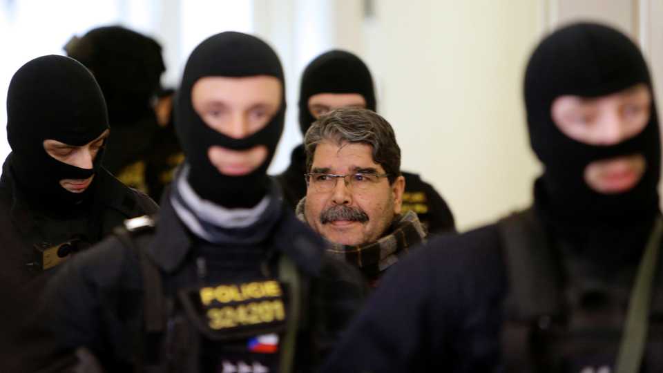 Former co-chair of the PYD terror group, Salih Muslum, is escorted to a Czech court in Prague, Czech Republic, on February 27, 2018.