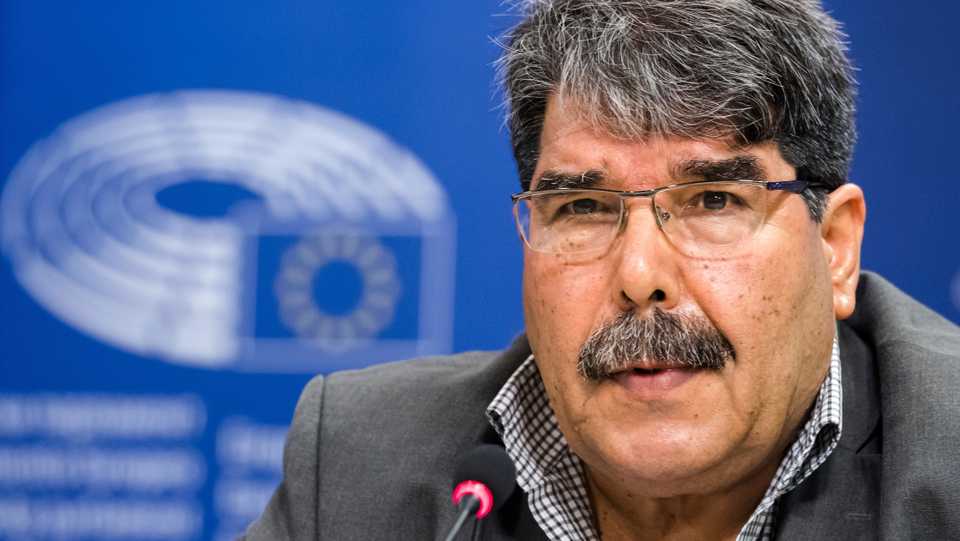 In this September 1, 2016 file photo, then co-chair of the PYD Salih Muslum addresses journalists at the European Parliament in Brussels.
