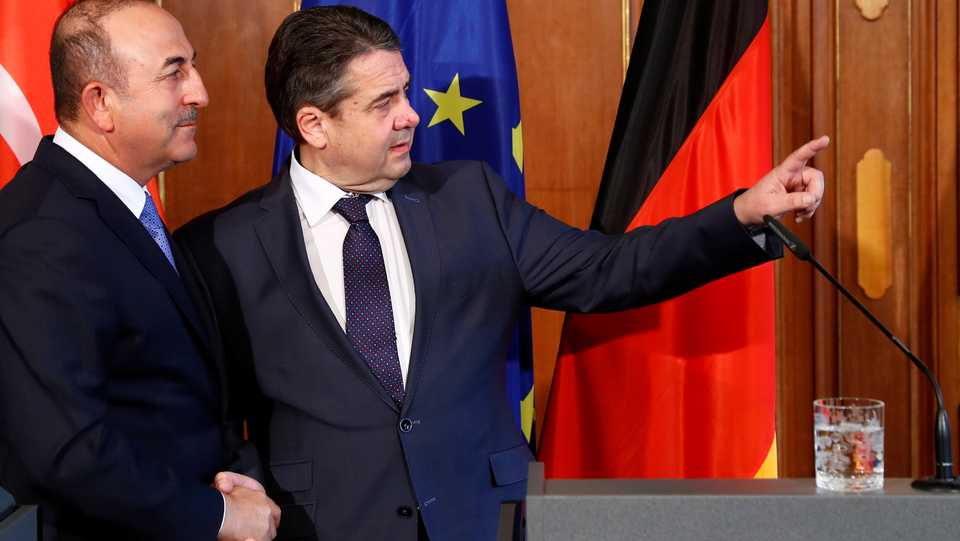 Turkish Foreign Minister Mevlut Cavusoglu and his German counterpart Sigmar Gabriel talk after a statement in Berlin, Germany, March 6, 2018.