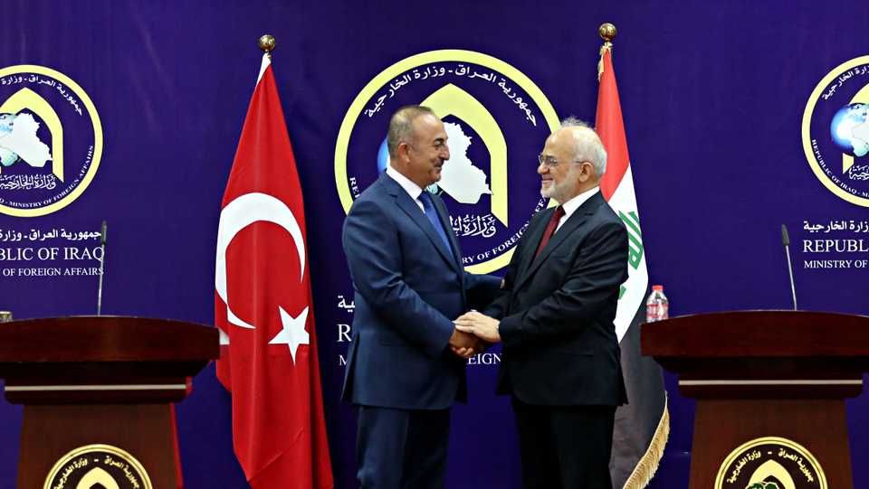 In this August 23, 2017 file photo, Turkish Foreign Minister Mevlut Cavusoglu, left, shakes hands with Iraqi Foreign Minister Ibrahim al Jaafari after a joint press conference in Baghdad, Iraq.