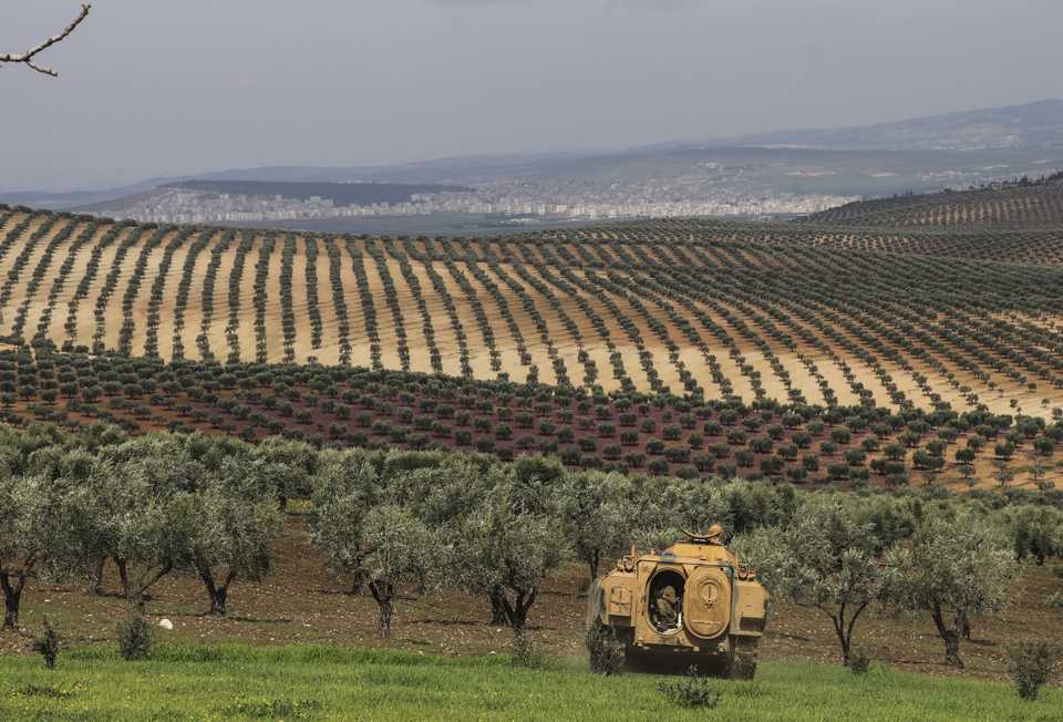 An armored military vehicle belonging to the Turkish army is seen near olive trees as Turkish Armed Forces and Free Syrian Army (FSA) deployed forces 1.5 kilometers from the town of Afrin, Syria on March 12, 2018.