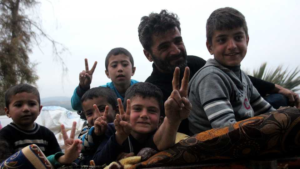 Civilians who had previously fled their homes return to Afrin on March 19, 2018, after Turkey's military and the Free Syrian Army (FSA) took complete control of the town, driving out the YPG.