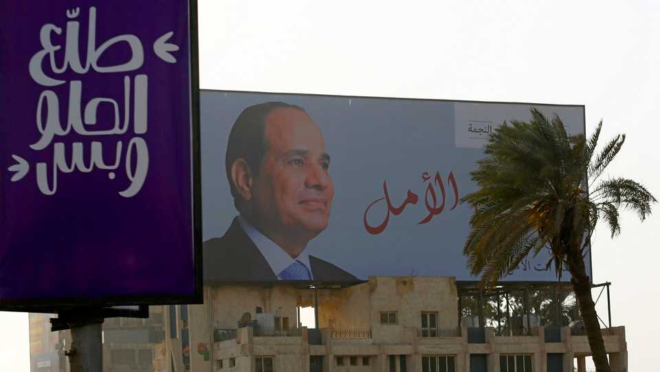 A poster of Egypt's President Abdel Fattah el Sisi is seen with words reading 