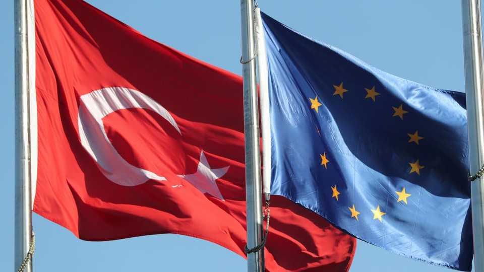 European Union (R) and Turkish flags fly at the business and financial district of Levent in Istanbul, Turkey on September 4, 2017.