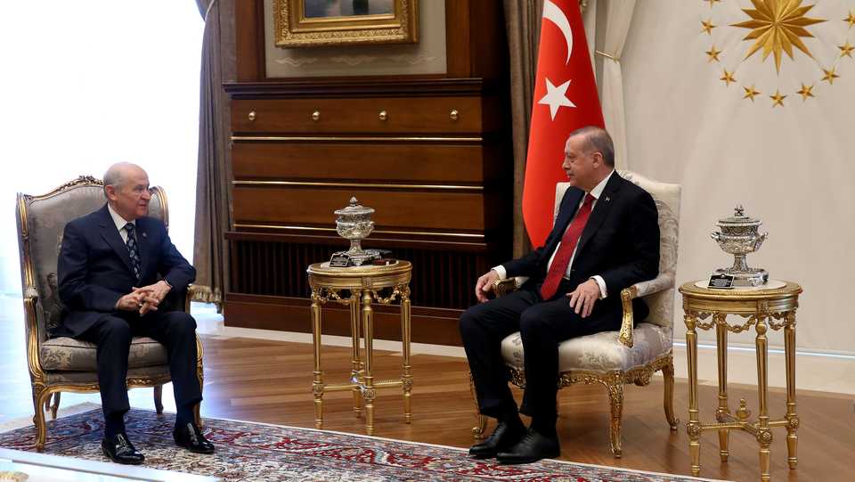 Turkish President Recep Tayyip Erdogan (R) with Nationalist Movement Party (MHP) leader Devlet Bahceli (L) at the Presidential Palace in Ankara, Turkey, on April 18, 2018.