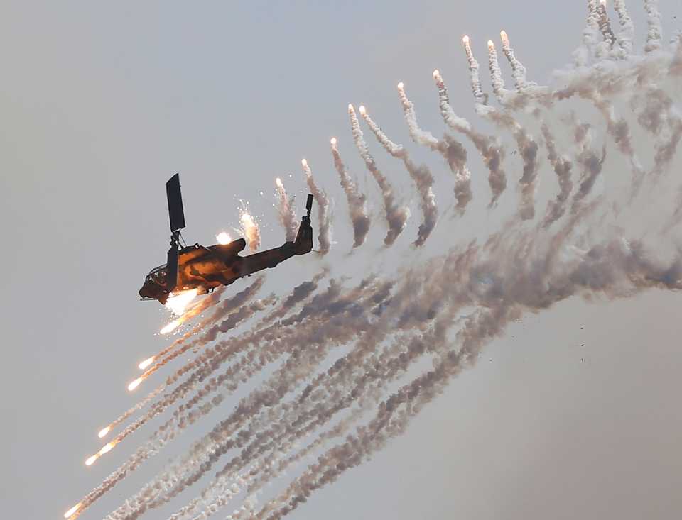 The Turkish-made military attack helicopter, T-129 ATAK, fires at high velocity in a military drill in Turkey.