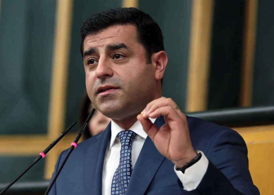 In this May 17, 2016 file photo, Selahattin Demirtas, the leader of the Peoples' Democratic Party, HDP, addresses lawmakers at the parliament in Ankara.