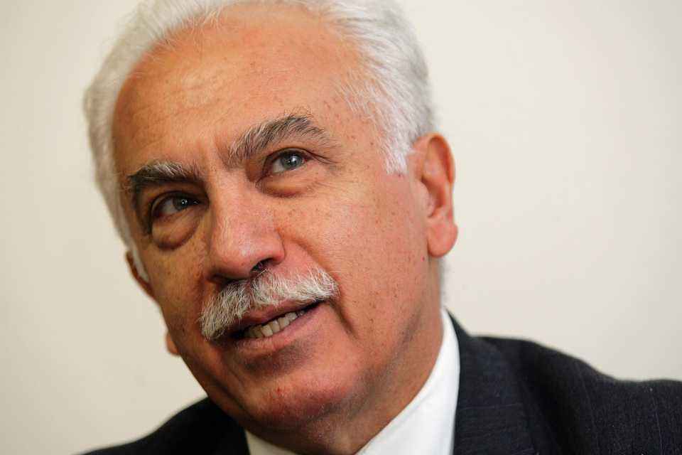 In this September 20, 2005, file photo, Dogu Perincek speaks to journalists in Lausanne, Switzerland.