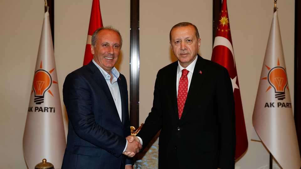 President of Turkey and leader of the AK Party Recep Tayyip Erdogan and presidential candidate for the main opposition CHP Muharrem Ince (L) shake hands at AK Party's headquarters in Ankara, Turkey on May 9, 2018.