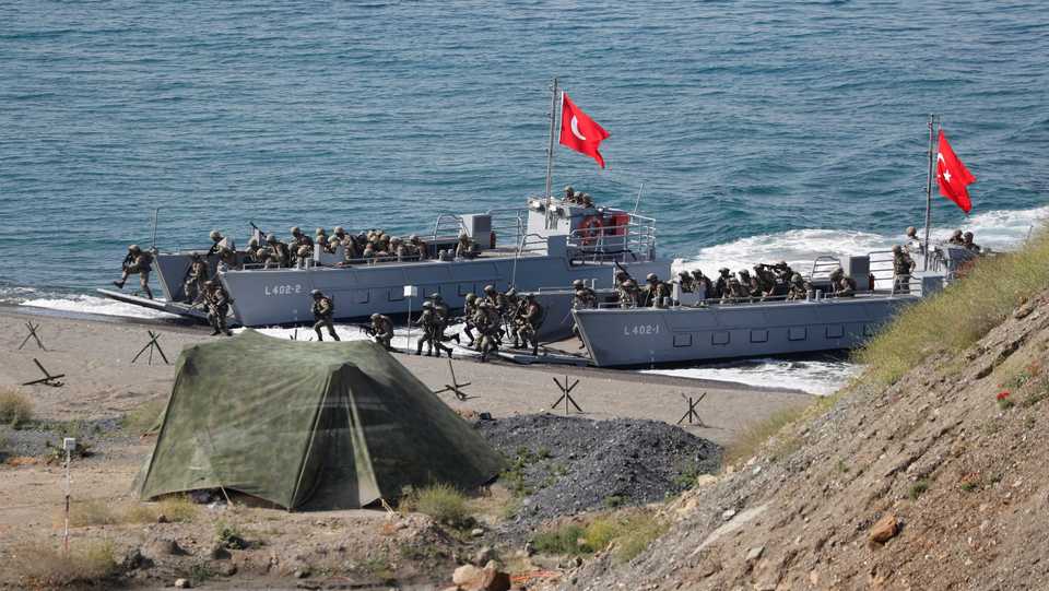 Turkish marines take part in a live fire drill during the EFES-2018 Military Exercise near the Aegean port city of Izmir, Turkey on May 10, 2018.