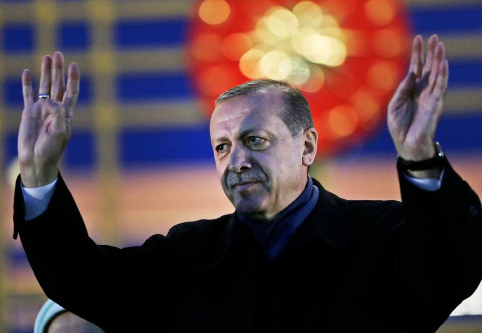 In this April 17, 2017 file photo, President Recep Tayyip Erdogan, gestures after delivering a speech during a rally of supporters a day after the referendum, outside the Presidential complex, in Ankara, Turkey.