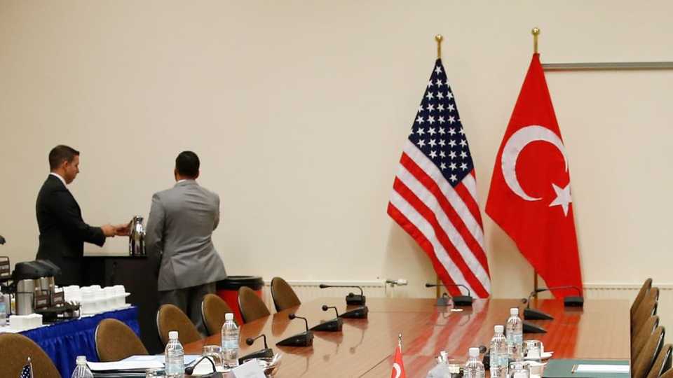 A US and a Turkish flag are seen ahead of the start of a meeting between American and Turkish officials in Brussels, Belgium, Dec. 20, 2015.
