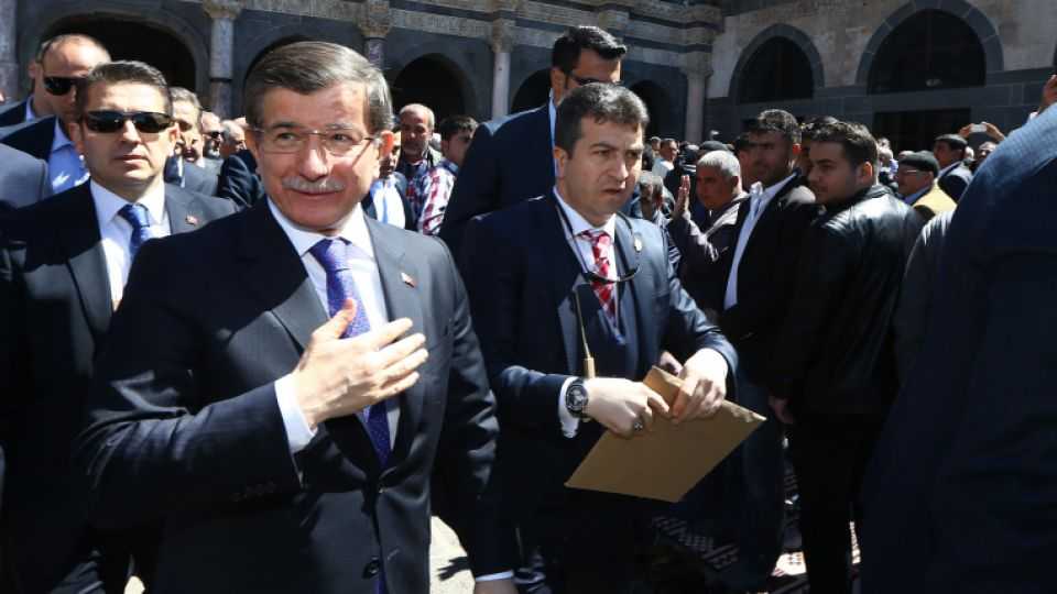 Turkish Prime Minister Ahmet Davutoglu greets Turkish citizens as he arrives at the Great Mosque to perform Friday Prayer in Diyarbakir, Turkey on April 01, 2016.