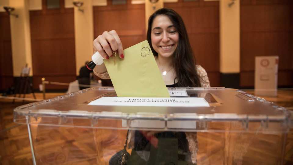 A Turkish woman casts her vote in early presidential and general elections at the Turkish Embassy in Washington, United States on June 9, 2018.
