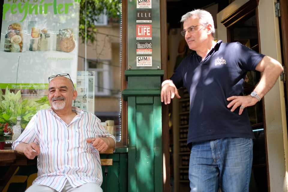 Two friends, a CHP supporter, Mehmet (L) and an AK Party supporter, Ibrahim (R) reflect on the upcoming elections in front of a small shop in Beyoglu’s hip district of Cihangir, Istanbul, June 7, 2018.