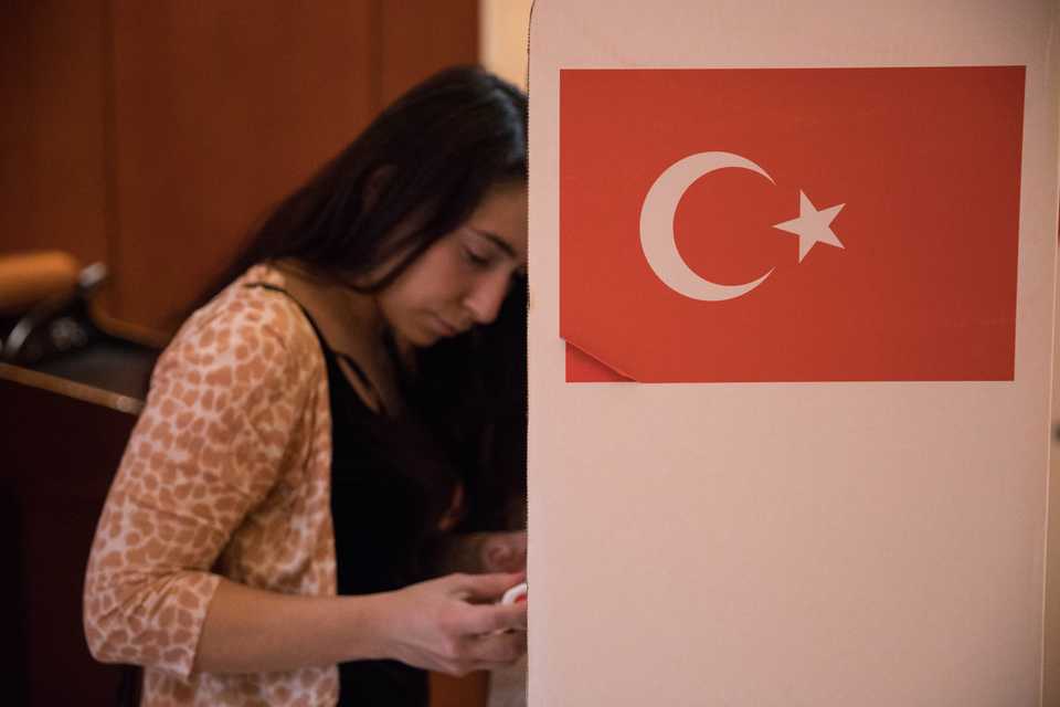A woman prepares to cast her vote at the Turkish embassy in Washington, United States on June 9, 2018.