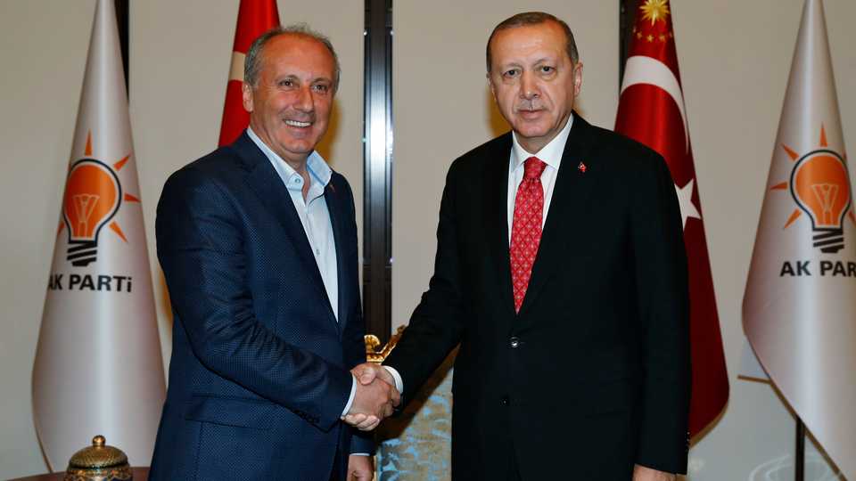 Turkey's President Recep Tayyip Erdogan, right, shakes hands with Muharrem Ince, Turkey's main opposition Republican People's Party (CHP) lawmaker and the party's presidential candidate, prior to their meeting at Erdogan's governing Justice and Development (AK) Party offices, in Ankara, Turkey, Wednesday, May 9, 2018.