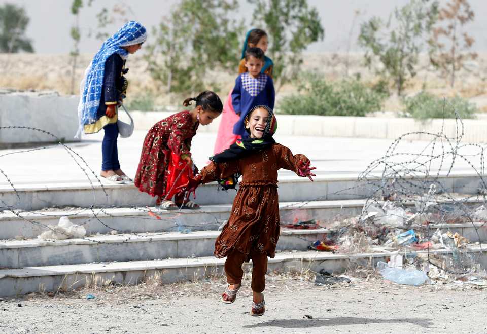 Afghan girls play on the first day of the Muslim holiday of Eid al Fitr, which marks the end of the holy month of Ramadan, in Kabul, Afghanistan June 15, 2018.