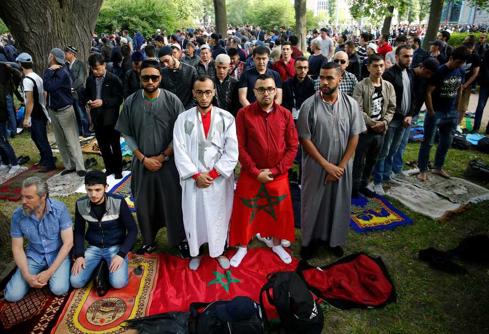 Supporters of the Moroccan national soccer team attend an Eid al Fitr mass prayer to mark the end of the holy fasting month of Ramadan in Saint Petersburg, Russia June 15, 2018.