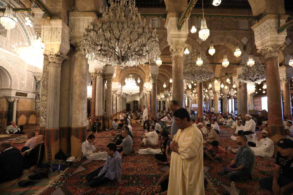 Muslims gather to perform the Eid al Fitr prayer at Al Zaytuna Mosque in Tunis, Tunisia on June 15, 2018.