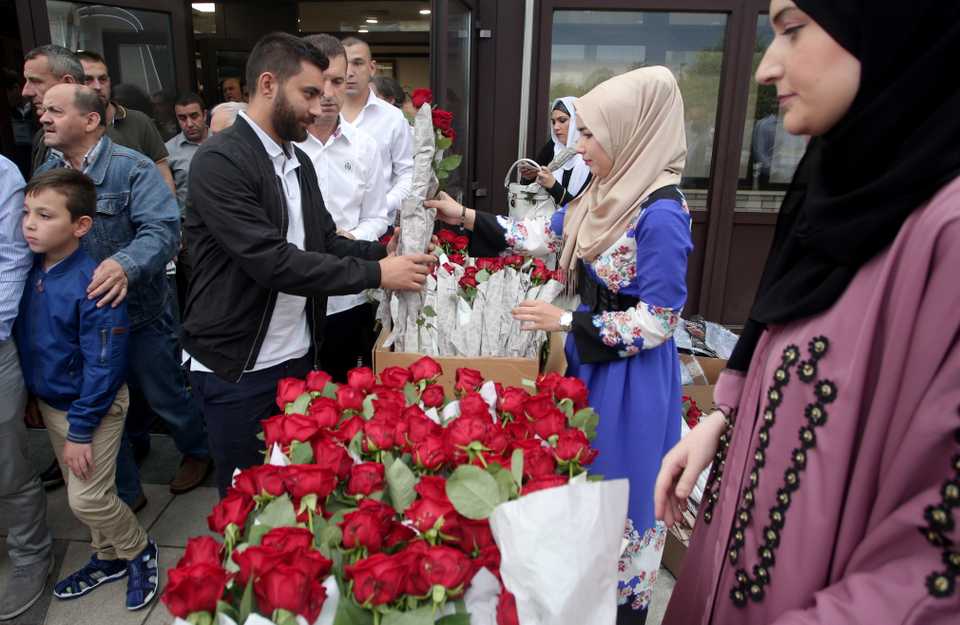 People greet each other after performing the Eid al Fitr prayer at Zagreb Mosque in Zagreb, Croatia on June 15, 2018.