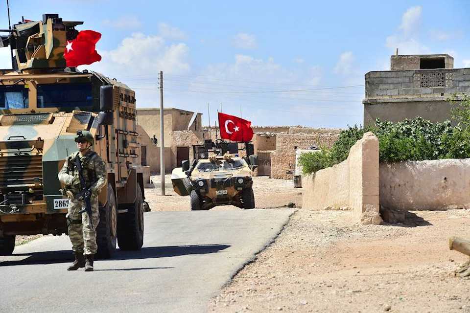 Armoured vehicles of the Turkish Armed Forces start to patrol between the northern Syrian city of Manbij and Turkey's Operation Euphrates Shield area on June 18, 2018.