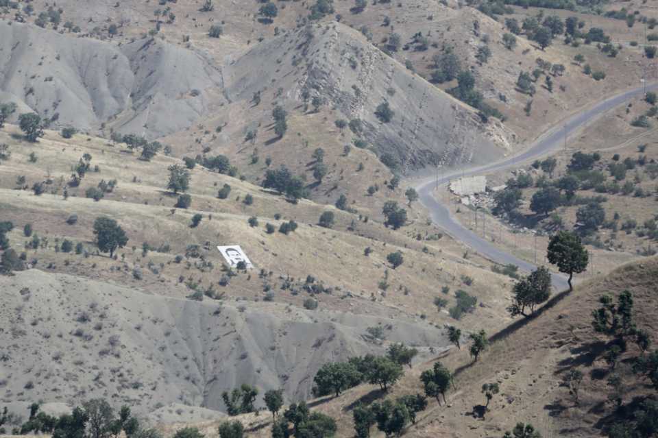 In this June 9, 2018 file photo, the PKK and the YPG terrorist leader Abdullah Ocalan's poster is seen at northern Iraq's Mount Qandil. The Turkish army has carried out air strikes there regularly since July 2015, when the PKK resumed its armed campaign.
