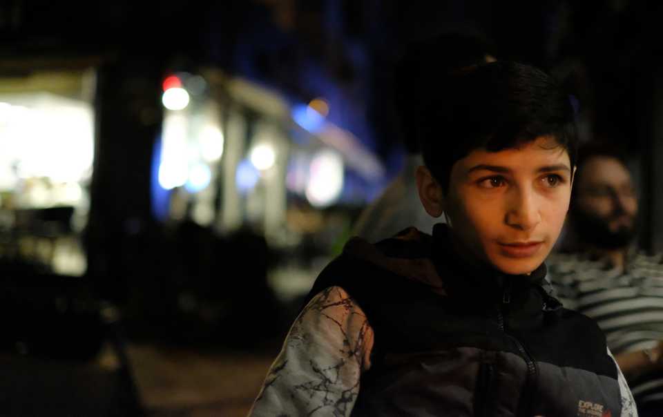 Mohamed, an 11 year old refugee from Syria's Aleppo, selling tissues in the streets of Karakoy to earn milk money for his baby sibling. June, 12, 2018, Karakoy, Istanbul. (Bilge Kotan/TRT World)