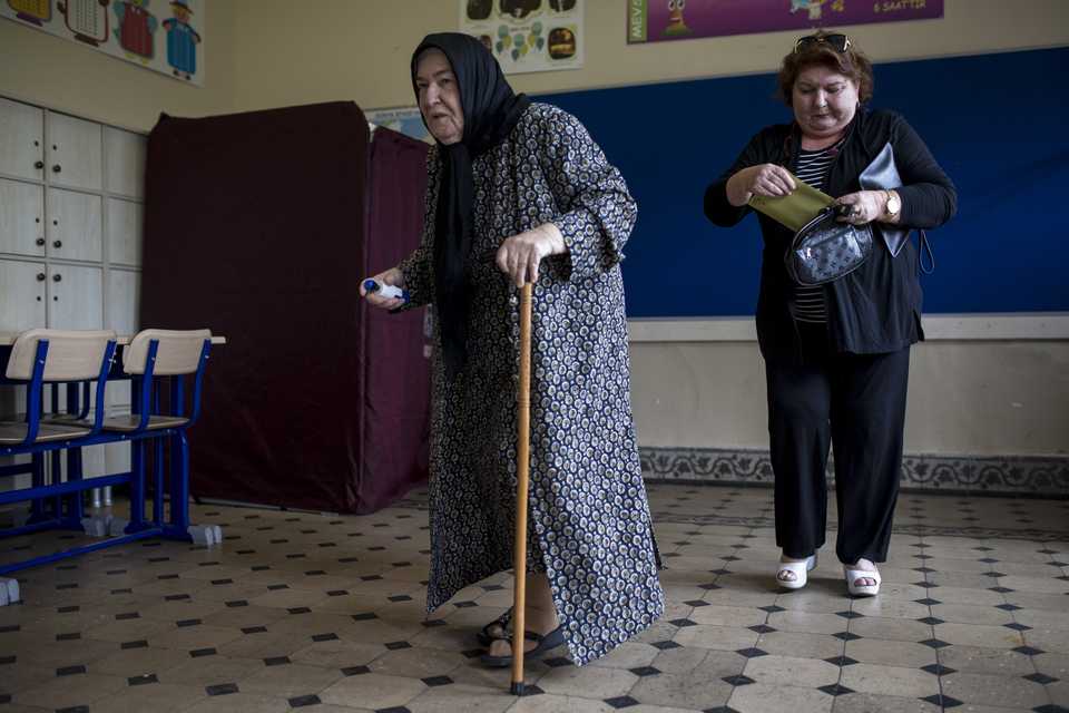 Voters arrive to cast their ballots at a polling station during the parliamentary and presidential elections, in Istanbul, Turkey on June 24, 2018.