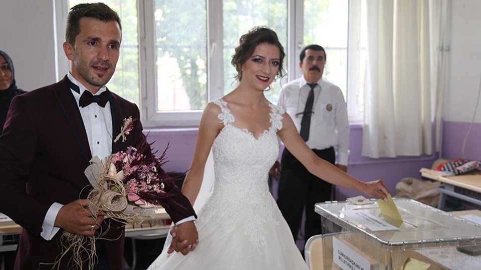 A couple from the central-western province of Eskisehir cast their votes in their wedding attire on June 24, 2018.