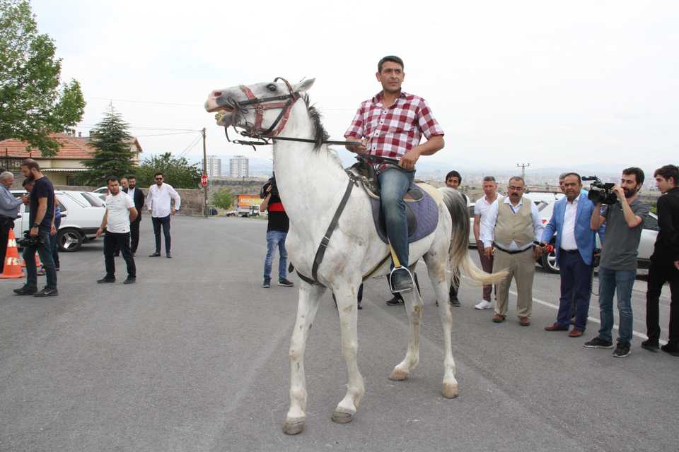 Mustafa Yurtlu, 42, rode his horse to the polling station in the central Anatolian city of Kayseri.