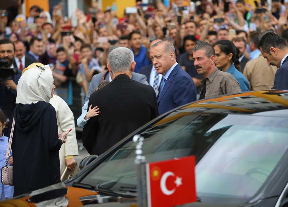 Turkish President Recep Tayyip Erdogan talks with citizens after casting his vote at a polling station during the parliamentary and presidential elections, at Uskudar district in Istanbul, Turkey on June 24, 2018.